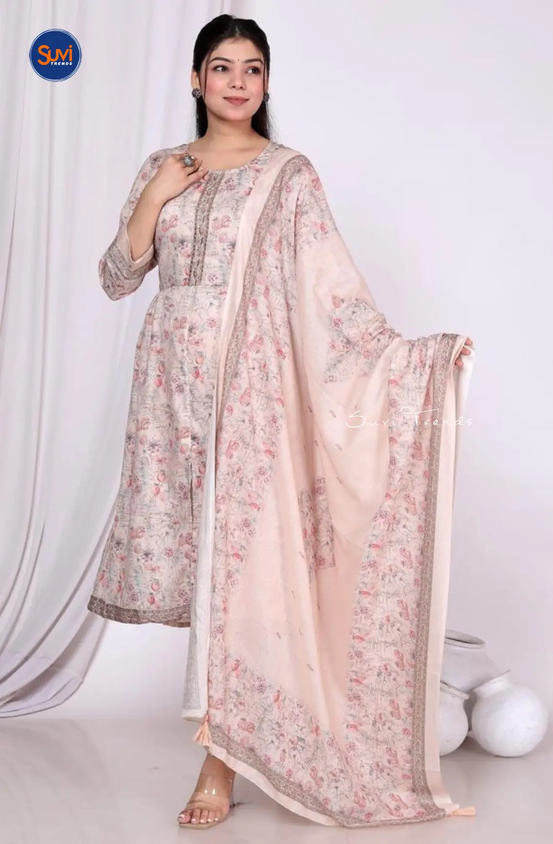 Experience the beauty and elegance of our All Over Printed Anarkali Suit Set in beige. Made with high-quality muslin fabric, this set features a round neck and 3/4 sleeves for a comfortable fit. Complete with pants and a dupatta, this Indian ethnic wear is perfect for any occasion. Get the best price and conveniently buy online in Malaysia. Elevate your wardrobe with this must-have set.