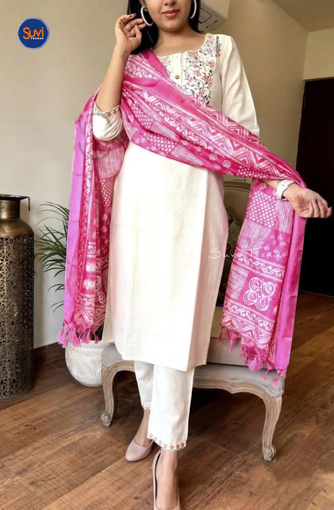 Elevate your ethnic wear game with this off-white cotton kurta set! Featuring intricate floral embroidery, a round neck, and 3/4 sleeves, this set is perfect for any occasion. The straight cut design, paired with a pant and dupatta, creates a flattering silhouette. Shop now for the ultimate Indian ethnic wear experience.