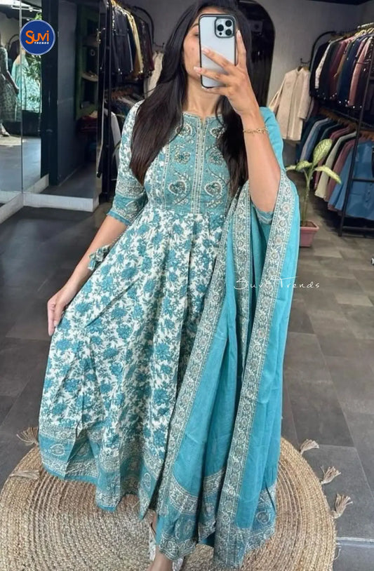 Indulge in the vibrant charm of this Cotton Printed Anarkali Suit Set in blue. The flared silhouette and asymmetric neck make it perfect for any occasion. The set includes a matching pant and dupatta, giving you a complete Indian ethnic look. Elevate your style with this must-have for women, available for purchase online in Malaysia.