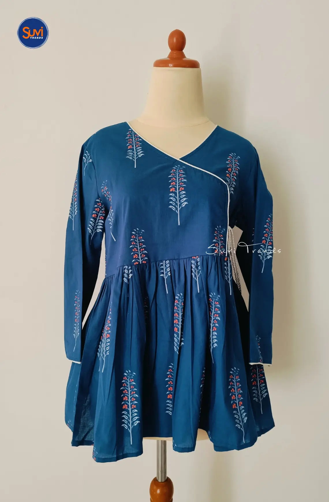 Feel confident and stylish in our navy blue Floral Printed Angrakha Kurti. Made with soft cotton, this short top features a beautiful floral print and flattering angrakha pattern. The v neck and 3/4 sleeves add a touch of elegance, while the peplum cut accentuates your figure. Available for purchase online in Malaysia.