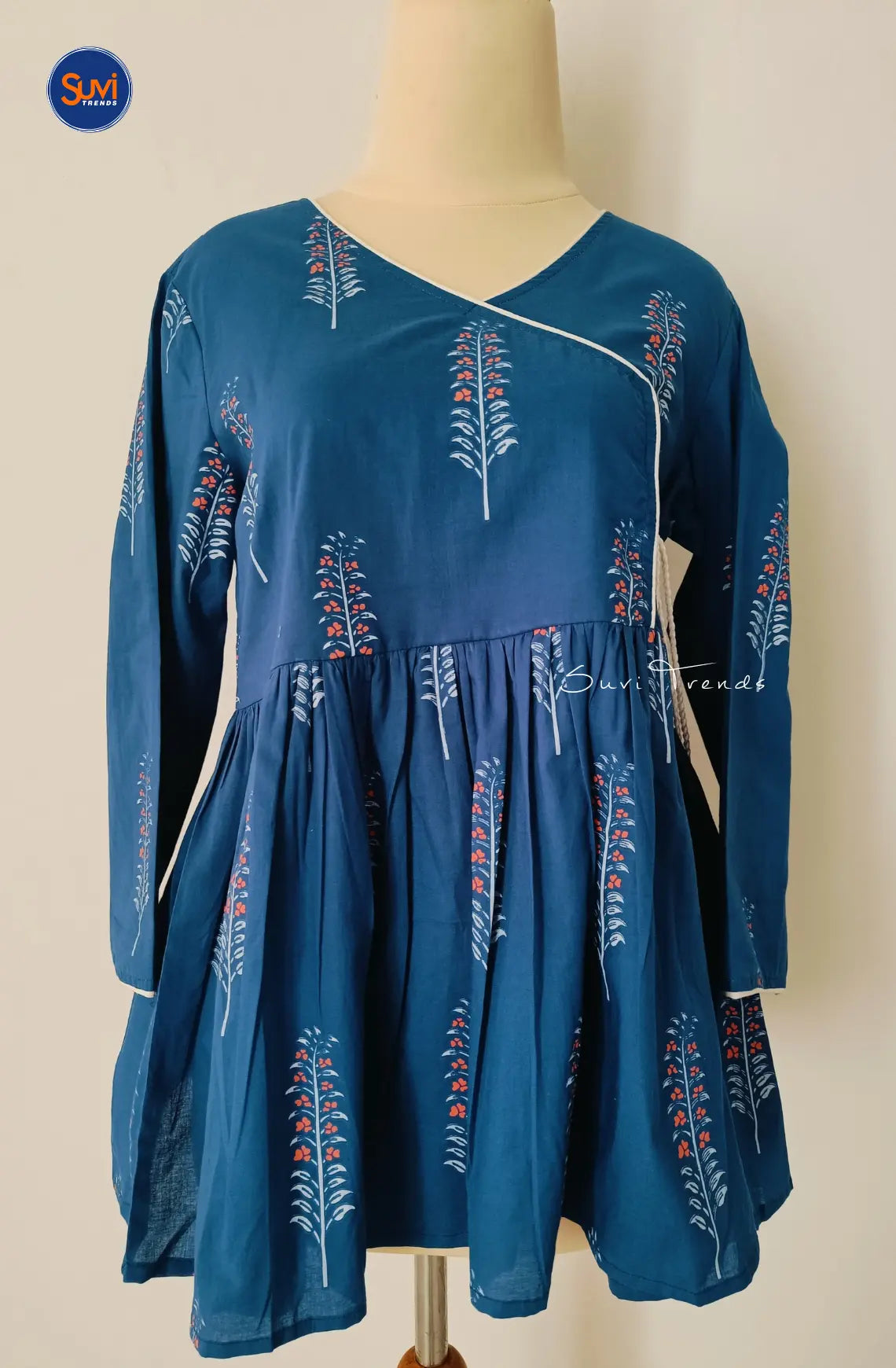 Feel confident and stylish in our navy blue Floral Printed Angrakha Kurti. Made with soft cotton, this short top features a beautiful floral print and flattering angrakha pattern. The v neck and 3/4 sleeves add a touch of elegance, while the peplum cut accentuates your figure. Available for purchase online in Malaysia.